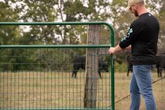 Our 2" x 4" wire-filled gate keeps horses and small animals safely contained with no dangerous catch points. Our 2" x 4" wire-filled gate is constructed with 1-3/4" round steel tubing and our corrosion-resistant powder coat finish and arrives complete and ready to hang with hinge pins and snap chain. Notes: all 1-3/4" gates are 3" shorter than listed length to allow for gate hardware and proper clearance. Recommended for light confinement only. Tarter 4-ft H x 12-ft W Green Powder Over E-coat Steel Corral Flat-top Farm Fence Gate | WFGG12 Farm Fence Gate, Metal Fence Gates, Metal Fencing, Top Farm, Farm Gate, Driveway Entrance, Farm Fence, Gate Hardware, Metal Fence