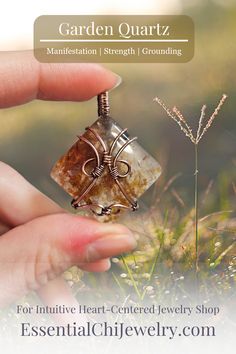 Indulge in the harmonious blend of strength and celestial beauty with our Hematite Garden Quartz Copper Wire Wrapped Necklace. The square-shaped garden quartz, resembling a wrapped package, showcases hematite inclusions, iridescent rainbows, and rutile. This handcrafted masterpiece promotes balance, protection, and a radiant connection to the divine. Perfect for Aries and Aquarius, this unique pendant aligns with the root and crown chakras, making it a symbol of grounding and spiritual elevation Nature-inspired Rectangular Jewelry For Gifts, Nature-inspired Rectangular Jewelry Gift, Rectangular Hand Wrapped Jewelry Gift, Spiritual Elevation, Aries And Aquarius, Garden Quartz, Wrapped Necklace, All Zodiac Signs, Wire Wrapped Necklace