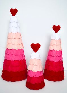 three red and white cones with hearts on them