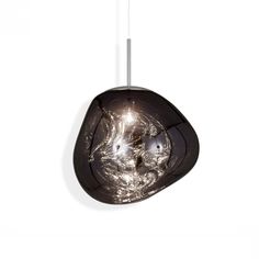 a black glass light hanging from a ceiling