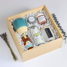 an open wooden box filled with different types of condiments