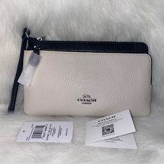 Coach Double Zip Wallet New With Original Packaging 100 % Authentic Chalk Black Multi Silver Tone Hardware Approximate Measurements L 8.0" H 4.75" W 1.0" Refined Pebble Leather Fabric Lining Wrist Strap Attached Smoke Free Designer White Clutch For Everyday Use, Designer White Clutch For Daily Use, Designer White Leather Clutch, White Rectangular Coach Clutch, Coach Luxury Clutch For Everyday, White Leather Clutch With Removable Pouch, Designer White Pouch Clutch, Coach Leather Clutch For Daily Use, White Coach Clutch For Travel