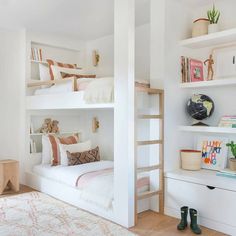 a bedroom with bunk beds and lots of shelves