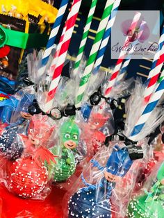 many different colored candy lollipops in plastic bags