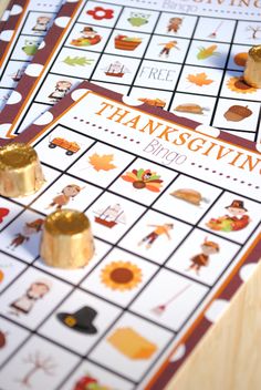 two thanksgiving games are sitting on top of each other, one is gold and the other is red