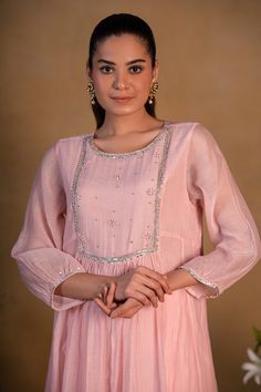 Rose pink chanderi kurta with embroidered yoke and panelled sides.
Component: 1
Pattern: Embroidered
Type Of Work: Zardozi work, Sequins
Neckline: Round
Sleeve Type: Three quarter
Fabric: Chanderi
Color: Pink
Other Details: 
Attached lining
Note: Pant worn by the model is not for sale
Occasion: Reception - Aza Fashions Zardozi Work, Kurta For Women, Types Of Work, Luxury Sale, Kurta With Pants, Womens Tunics, Festival Wear, Rose Pink, Aza Fashion