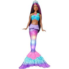 a barbie doll wearing a purple and blue mermaid outfit with long hair, standing in front of a white background