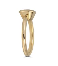 a yellow gold ring with an oval shaped design on the front and side, set against a white background