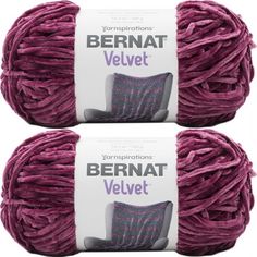 two balls of yarn with the words bernat velvet written on them in white and purple