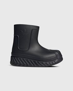 Modern Black Waterproof Boots For Outdoor, Streetwear Boots With Studded Rubber Outsoles, Sporty Black Boots With Rubber Toe Cap, Modern Synthetic Boots For Streetwear, Synthetic Slip-on Boots For Streetwear, Casual Black Nylon Waterproof Boots, Black Casual Nylon Boots, Casual Black Nylon Boots, Slip-on Boots With Textured Sole For Streetwear