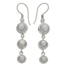 Silver moonlight radiates from luminous pearls. Set in argent circles, they become dancing dangle earrings by Bali's Nyoman Rena. Sterling silver and freshwater pearls Hook earrings Handmade in Indonesia White Pearl Jewelry, Pearl Dangle Earrings, Printed Jewelry, Silver Dangle Earrings, Sterling Silver Dangle Earrings, Pearl Earrings Dangle, Beaded Dangle Earrings, Freshwater Cultured Pearls, Cat Earrings