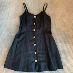 Super Cute, Never Worn Black Button-up Mini Dress For Summer, Black Sleeveless Mini Dress With Buttons, Black Button-up Beach Dress, Black Dress With Buttons For Vacation, Black Dress With Button Closure For Date Night, Black Urban Outfitters Beach Dress, Black Beach Dress From Urban Outfitters, Black Beach Dress By Urban Outfitters, Casual Black Dresses By Urban Outfitters