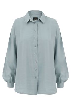 The Summer loose oversize shirt in a pale sea color. The shirt has dropped shoulders, a rounded hem and slightly ruffled buff sleeves finished with an elegant one button cuff. The shirt has pearl buttons in a tone on tone fabric. It is made from a linen-cotton-viscose fabric. The shirt is ideal for summer, with trousers or shorts. Materials Viscose 100%. Size & Fit The model in the photo is 177cm tall Dimensions of the shirt laid out flat: Overall length 74cm Width at bust 61cm Sleeve length mea Buff Sleeves, Sea Colour, Oversize Shirt, Tone On Tone, Quality Dresses, Cotton Viscose, Viscose Fabric, Pearl Buttons, Sustainable Clothing