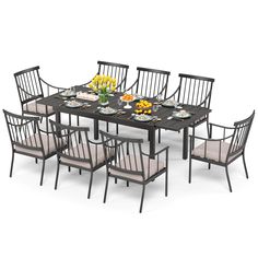 an outdoor dining table with eight chairs and plates on it, set against a white background