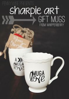 two white mugs with tags on them sitting next to each other and the words, sharpie art gift muss from whimberry