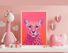 a pink poster with a cheetah on it next to some heart shaped decorations