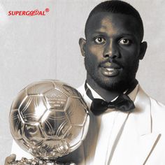 a man in a tuxedo holding a soccer ball