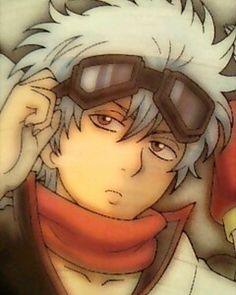 an anime character with goggles and a scarf around his neck is looking at the camera