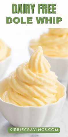 three white bowls filled with whipped cream on top of a marble counter topped with text overlay reading dairy free dole whip