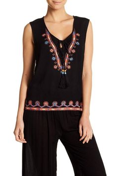 La Moda Women's Sleeveless Embroidered Lounge Black Top with Tassels |  Lace Up Top - Hot Boho Resort & Swimwear Black Summer Tops With Tassels, Black Tassel Tops For Summer, Casual Black Tassel Top, Black Bohemian Tank Top, Bohemian Black Cotton Tank Top, Black Bohemian Cotton Tank Top, Black Sleeveless Bohemian Top, Chic Sleeveless Tassel Tops, Casual Sleeveless Top With Tassel Ties