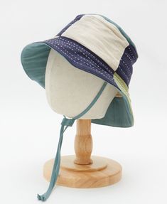 Meet the Checkered Baby Bucket Hat—the ultimate accessory for sunny adventures! Crafted from 100% organic cotton and azo free dyes, this baby hat features a bold checkered pattern in fun shades of blue and green that will make your little one stand out. With a 2" brim, it offers just the right amount of shade to keep your mini-me cool and comfy during stroller strolls. The cotton stopper ensures a secure fit without any plastic hardware, so this hat stays put through all their adorable giggles a Baby Bucket Hat, Vintage Kantha Quilts, Pillow Fabric, Fabric Baskets, Vintage Kantha, Linen Shop, Quilted Pillow, Baby Hat, Checkered Pattern