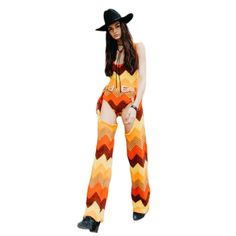 This firey matching set is sure to make you stand out in the crowd! Perfect for festivals, rodeos and everything in between.  This co-ord comes with a crochet bodysuit and matching chaps!  Pair with your favourite western accessories and you're ready to go!    Model is 5'8'' Size would best suit US size XS- Small   *This is a one of a kind piece and cannot be re-created* Bohemian Style Fitted Sets For Fall, Fitted Bohemian Sets For Fall, Fitted Orange Bohemian Sets, Fitted Bohemian Festival Clothing Set, Fitted Bohemian Festival Set, Bohemian Fitted Festival Sets, Crochet Western, Fringe Two Piece, Crochet Bodysuit