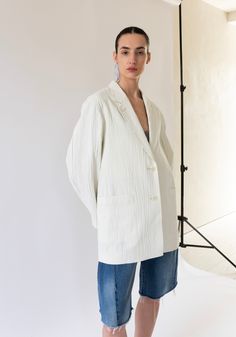 Two Button Blazer in Ivory from Sayaka Davis. An oversized single-breasted blazer, in a crinkled cotton-linen. Features notched lapel, rounded shoulder, 2 patch pockets and 1 interior coin pocket. Model is wearing size small. Need a second opinion? If you have special requests or just need advice, please reach out to hello@shop-vestige.com. 65% Cotton, 35% Linen, Lining 100% Cotton. Made in Japan As a reminder, all Sale items are Final Sale. Oversized Spring Blazer With Patch Pockets, Oversized Blazer With Patch Pockets For Spring, White Notch Lapel Outerwear With Patch Pockets, Chic Cotton Blazer With Patch Pockets, White Linen Outerwear With Single Button, White Single Button Linen Outerwear, White Linen Single Button Outerwear, White Linen Single-button Outerwear, White Linen Blazer With Button Closure