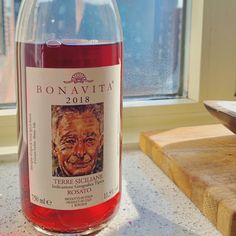 a bottle of wine sitting on top of a counter