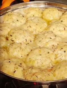 a pan filled with food sitting on top of a stove