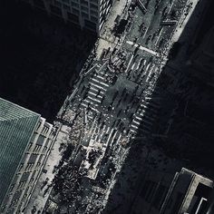 an aerial view of a city with tall buildings and lots of debris on the ground