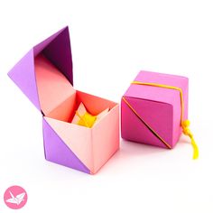 an origami box is open and sitting next to it