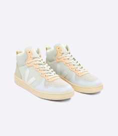 Sale Price was $139 with 15% off now $119.Men's VEJA V-15 pastel colors multico natural suede sneakers with pastel blue, beige, grey, purple and navy blue heel detail. Grosgrain ribbon detail on back heel. 100% suede leather upper. Insole made of recycled cotton & rubber. Outsole made of wild rubber from the Amazon.Logo V: Amazonian rubber (26%)Insole: Amazonian rubber (11%), sugar cane (42%), recycled E.V.A.* (11%) & organic cotton (12%)Outsole: Amazonian rubber (40%) and recycled rubber (10%)L Green Linen Shirt, Navy Blue Heels, Veja Sneakers, Suede Coat, Blue Heels, Sugar Cane, Retro Sneakers, Suede Sneakers, Rio Grande