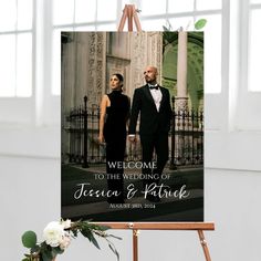 a welcome sign with a photo of two people in tuxedos and the words'welcome to the wedding of teresa & patrick '