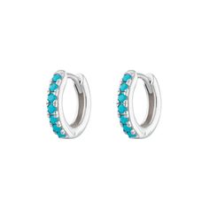 An easy win on the style front - these small huggie hoop sterling silver earrings  are decorated with these pretty faceted natural turquoise stones. An instant modern classic, they look gorgeous during the day and are comfortable enough to sleep in by night. They also look great in cartilage piercings higher up the ear.Whatever the vibrant colour of turquoise evokes in you, these dainty earrings pack a punch both on the colour and style stakes. The natural turquoise gemstones are on the front of Sterling Silver Gemstone Huggie Earrings For Everyday Wear, Turquoise Sterling Silver Huggie Jewelry, Everyday Sterling Silver Gemstone Huggie Earrings, Minimalist Sterling Silver Gemstone Huggie Earrings, Blue Sterling Silver Huggie Earrings, Blue Hypoallergenic Sterling Silver Huggie Earrings, Blue Small Hoop Huggie Earrings In Sterling Silver, Huggie Earrings Silver, Natural Turquoise Stone