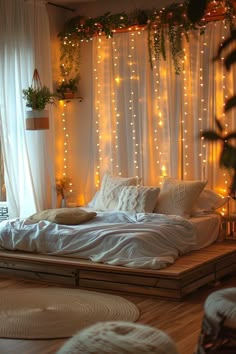 a bed with white sheets and lights on the wall above it, in front of a window