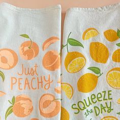 two tea towels with just peachy and squeezeeze the day designs on them