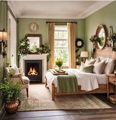 a bedroom with green walls, white bedding and a fireplace in the corner is decorated with potted plants