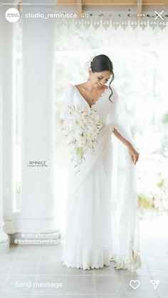 a woman in a white dress holding a bouquet of flowers