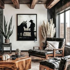 a living room filled with furniture and a painting on the wall