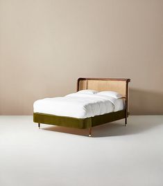 the bed is made up and ready for someone to use it in their home or office