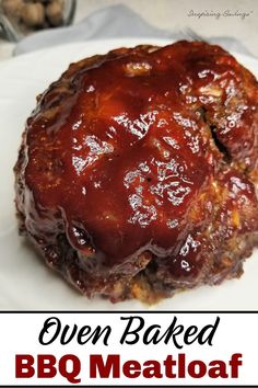 an oven baked meatloaf on a white plate with the words oven baked bbq meatloaf