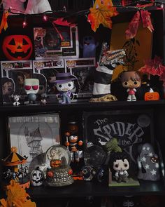 a shelf filled with lots of halloween decorations