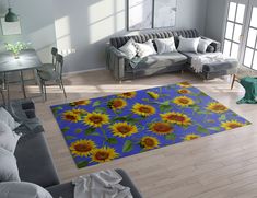 a living room with sunflowers on the rug