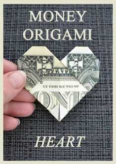 money origami heart made out of one dollar bill