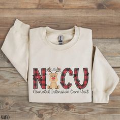 a white sweatshirt with the words ncu on it and a reindeer wearing antlers