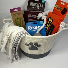 a dog themed gift basket filled with dogs treats and other things to put in it