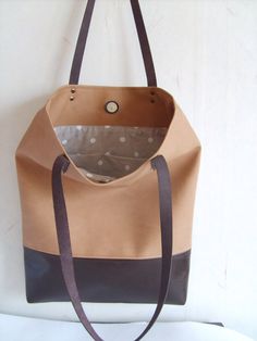 Large vegan leather tote - colorblcok vegan leather tote bag in sandy beige and dark brown. * Exterior: - Bottom - high quality vegan leather in dark chocolate brown -Top - high quality very durable vegan leather in sandy beige color * Interior: - 100 natural cotton in beige and white polka dot pattern * Two inside slip pockets * Real leather handles in dark chocolate brown attached with antique toned brass rivets * Closes with magnetic snap closure reinforced with natural leather Measurements: Tote Bag School, Beige Tote Bag, Beige Tote, Vegan Leather Tote Bag, Brown Tote Bag, Vegan Leather Tote, Dark Chocolate Brown, Bag School, Backpack Travel