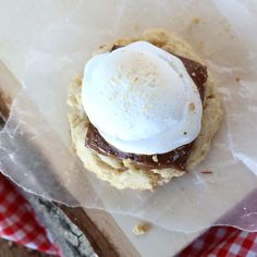 an ice cream sandwich is sitting on wax paper