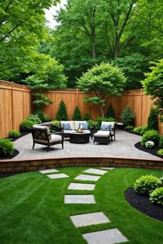 an outdoor patio with seating and trees in the background, surrounded by green lawning