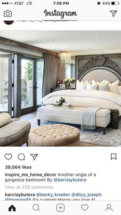 a large bed sitting in the middle of a bedroom next to a window with french doors